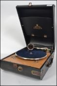 A vintage Decca Salon portable wind up picnic gramophone, with carry handle to the side having an
