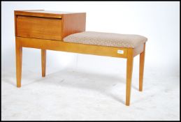 A retro mid century teak wood telephone table by Mr Chippy. Raised on squared legs with