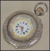 A silver 935 ladies fob watch with decorative enamel dial. The rococo case having open dial with