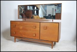 A superb Danish manner teak wood dressing by Kofod Larsen for G-Plan being raised on teak tapering