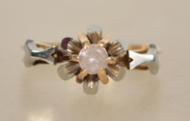 An 18ct gold and diamond single stone ladies ring. The round cut diamond approx 10pnts being claw