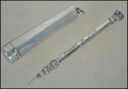 A silver hallmarked cheroot holder together with a silvered metal propelling pencil.