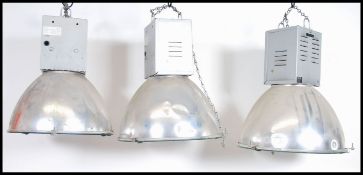 A pair of 20th century Industrial Hillclare factory pendant lights having half sphere polished