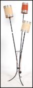 A 20th century French retro floor standing three point lamp, constructed from tubular metal raised