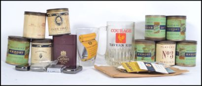 A collection of early to mid 20th century cigarette tins and cigarette packets to include Players No