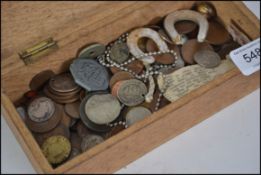 A collection of 19th and 20th century coins and tokens from around the world, silver and brass