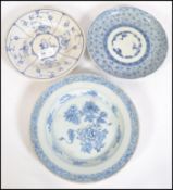 Three pieces of 19th century blue and white porcelain plates  to include Delft signed to base, two