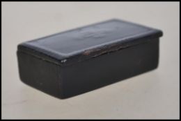 A 19th century Georgian papier Mache ebonised stamp box of small form with hinged lid having