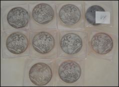 A group of 10 silver crowns coins to include mostly Victorian examples but with one Edwardian crown.