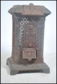 A large early 20th century decorative cast iron architectural stove - wood / coal burning. The large