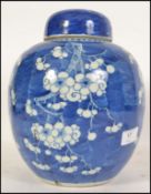 A Chinese blue and white porcelain ginger jar late 19th / early 20th Century decorated with prunus