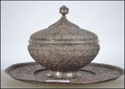 A 19th century Turkish silver plated dish and lidded bowl. Cast in relief with geometric scenes