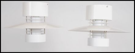 A set of 2 contemporary Industrial Glamox Luxo Aurora S ceiling lights of space age form being metal