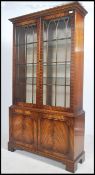 A good Regency revival mahogany library bookcase display cabinet having twin astragal glazed door