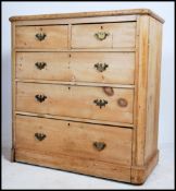 A Victorian country pine 2 over 3 chest of drawers being raised on a plinth base with 2 short over 3