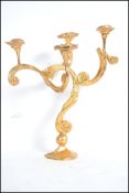 A stunning table centre piece five branch heavy cast metal candelabra having a gilt finish. Measures