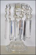 A stunning early 20th century table glass lustre having long glass faceted droplets under three