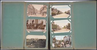 A stunning vintage early 20th century postcard album containing many topographical vistas, shipping,
