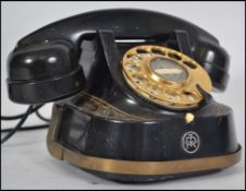 A Belgian black painted and gilt brass mounted telephone, marked 'Anvers Belgique Bell Telephone MFG
