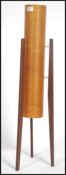 A retro 1960's teak and spun resin rocket floorstanding lamp, the orange cylindrical centre