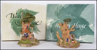 Two limited edition Woodly Wise from Moss Wood Hollow houses.  These Ted Stack replicas are highly