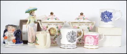 A collection of ceramics to include Commemorative wares, twin handled Coalport urns with lids, a