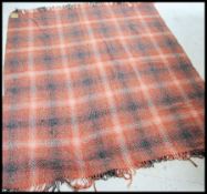 A Northern Irish vintage mid century Abercorn rug having chequered red and black design with
