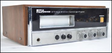 A retro JVC Nivico 8 / eight track  cartridge / cassette player. Having knobs and dials to the front