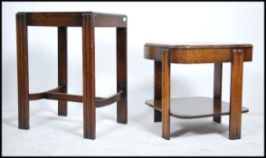 A 1930's Art Deco oak side table having reeded and banded supports with twin tiers together with