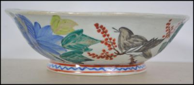 A believed 19th century Chinese ceramic famille rose bowl with handpainted decoration being signed