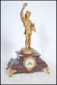 A 19th century large French rouge marble mantel clock. The large rouge marble base raised on