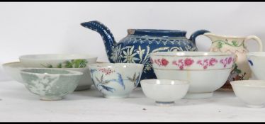 A collection of 19th and 20th century ceramics to include  tea bowls, teapot etc. The tallest