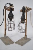 A pair of mid century trouble / inspection lamps raised on industrial - chemists test tube stands