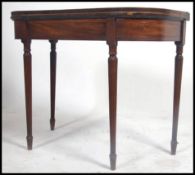 An early to mid19th Century  mahogany tea table, the rectangular top with rounded corners on