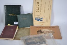An early 20th century autograph book with many signatures together with other ephemera to include
