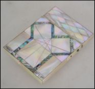 A mid 19th century Victorian mother of pearl and abalone card case, set with panels of abalone shell