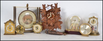 A collection of vintage 20th century clocks mantle and travel to include Westclox, Smiths, Oris etc.