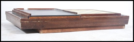 An unusual 20th century games table of mahogany form having shove ha'penny and skittles inset