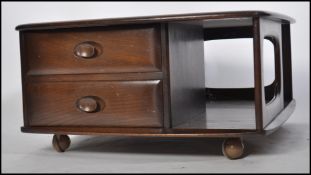 An original retro Ercol dark elm wood  Pandora cof