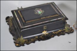 A mid 19th Century Victorian papier mache mother-of-pearl inlaid and gilt floral decorated writing