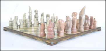 A 20th century carved soapstone chess set together