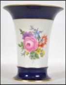 A modern Meissen cylindrical Vase, the flared rim with a gilt edge and decorated with mixed roses