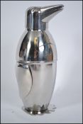 A contemporary 20th century  silver plated large novelty cocktail shaker in the form of a penguin.
