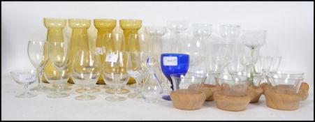 A collection of mixed glass ware to include a set of six toddy / hot punch glasses with wooden