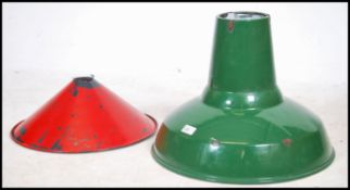 A vintage Industrial factory ceiling pendant light fixture having a green enamel finish together