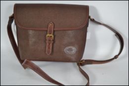 A vintage Mulberry chocolate brown scotch grain leather bag.  This handbag has front and interior