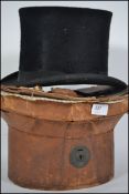 An late 19th / early 20th century Moleskin top hat in the original leather box. The hat having