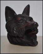 A beautiful carved wooden black forest inkwell in the form of a fox having hinged top with inkwell