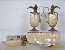 A small collection of mother of pearl and abalone items dating from the late 19th century to include