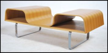 A retro 20th century veneered bentwood coffee table having sloped centre with raised sides and